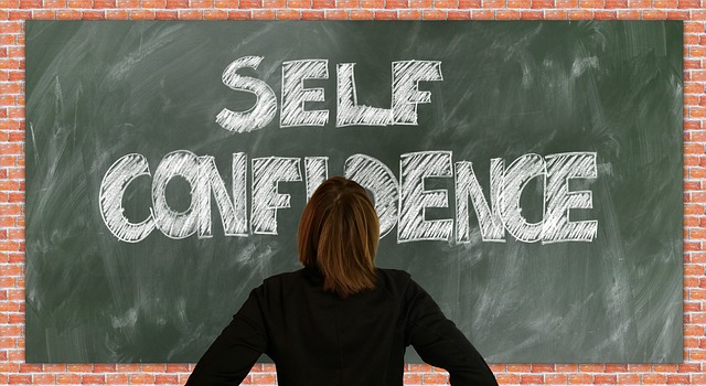 Picture of a board with the words "self confidence" on it 