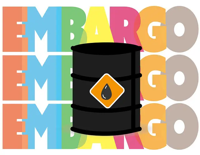 Picture of an oil barrel with the words "embargo" in the background