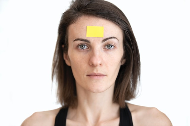 Woman with a sticker on her head 