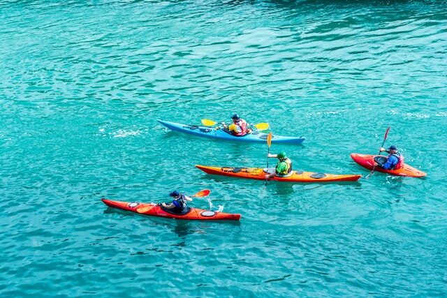 Picture of four kayaks in the sea