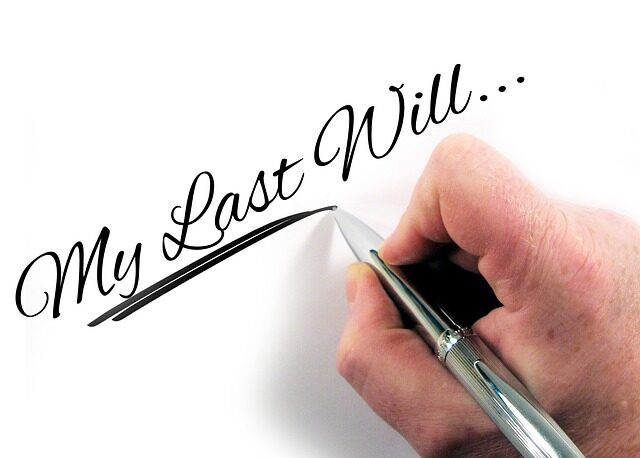 picture of person writing "My last will" on paper