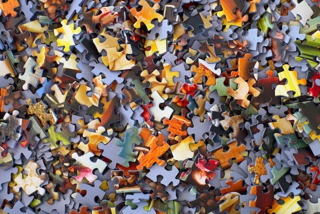 A puzzle is a problem or enigma that challenges one's ingenuity or knowledge.