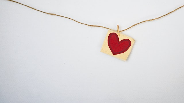 Picture of red paper heart hanging on a string