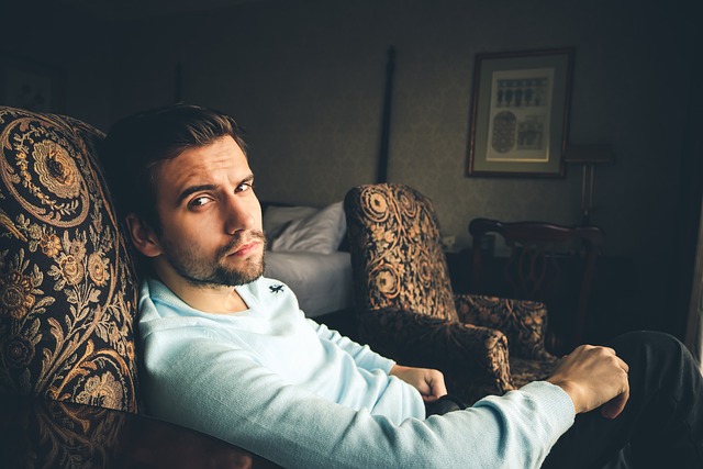 Picture of a man sitting on a couch