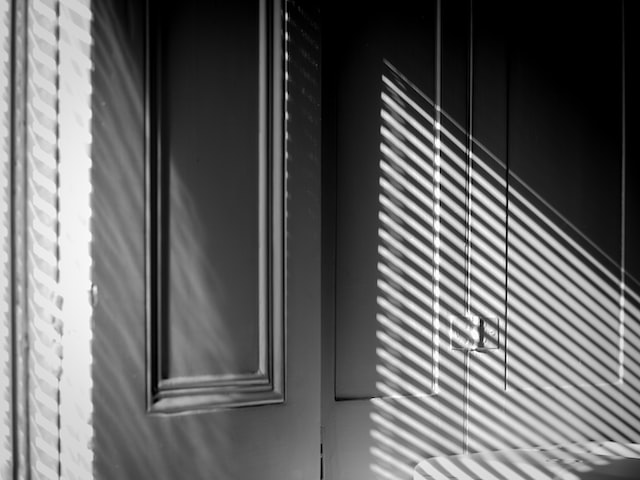 picture of window shutters blocking off sunlight 