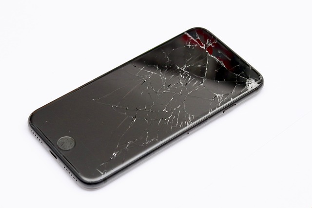 Picture of a smart phone with a cracked screen 