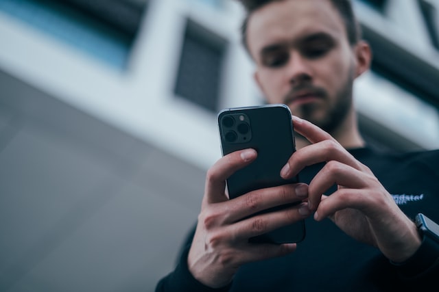 Picture of a person looking at a cell phone