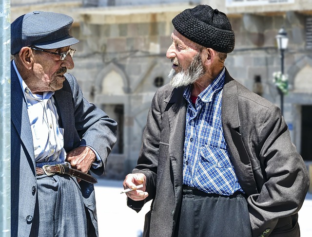 Picture of two old men speaking to each other