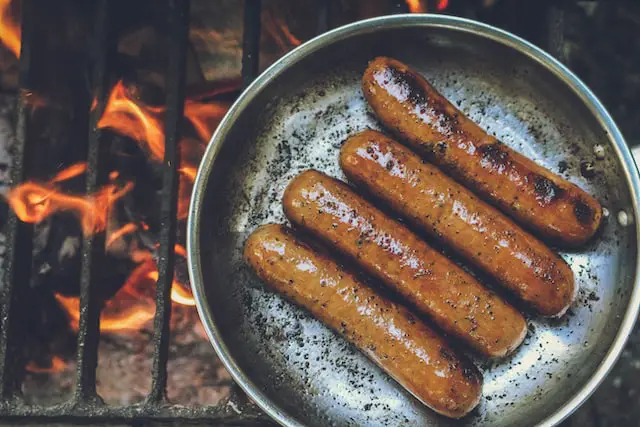 Picture of some sausages being cooked on a pan