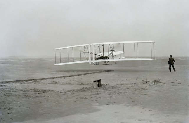 Picture of the wright brothers testing the aero plane 