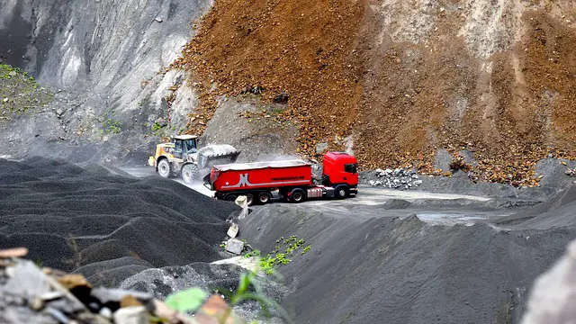 Picture of vehicles working on a quarry 