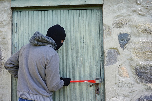 Picture of a person trying to break-in to a house 