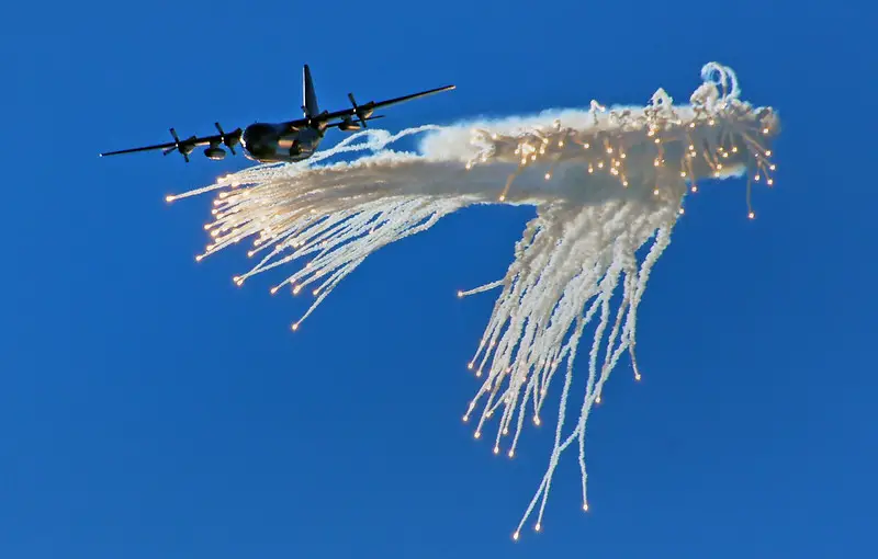 Picture of an aircraft dropping flares