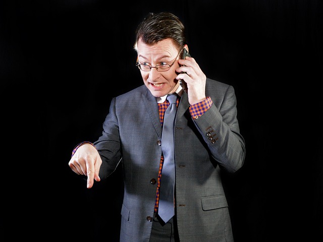 Picture of a person talking assertively on a phone