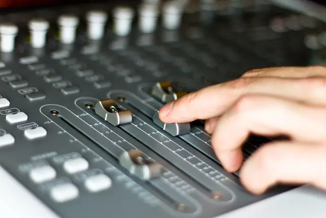 Picture of a person using a music mixer