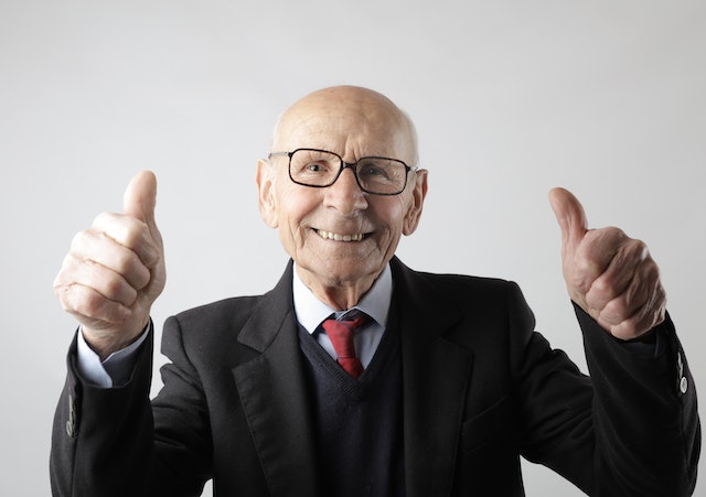 Picture of a person showing two thumbs up 