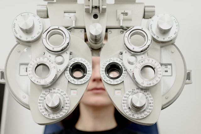 picture of a woman in a an optician s chair 