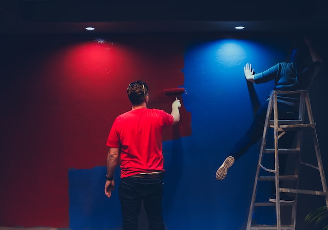 picture of a person painting a wall