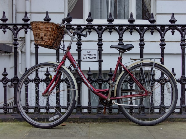 picture of a bicycle parked ironically in a place where bicycles are not allowed