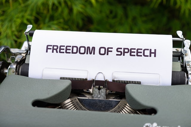 picture of a typewriter with the words "freedom of speech" typed on a paper