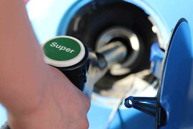 picture of a person pumping super gas