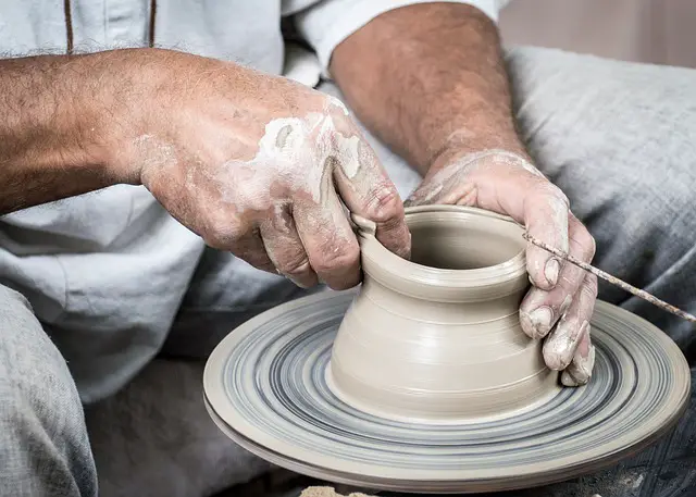 picture of a person sculpturing a piece of pottery 