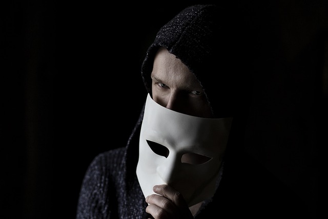 Picture of a person trying to maintain anonymity by using a mask 