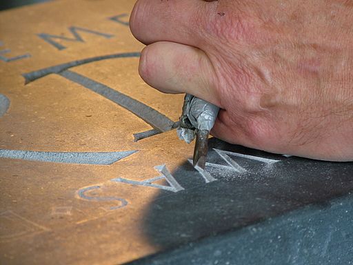 picture of a person engraving 