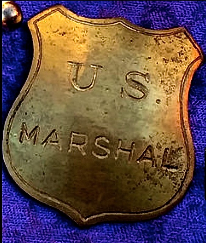 picture of an old U.S Marshall's badge 