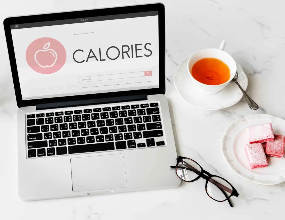picture of a laptop with the word "calories" on the screen