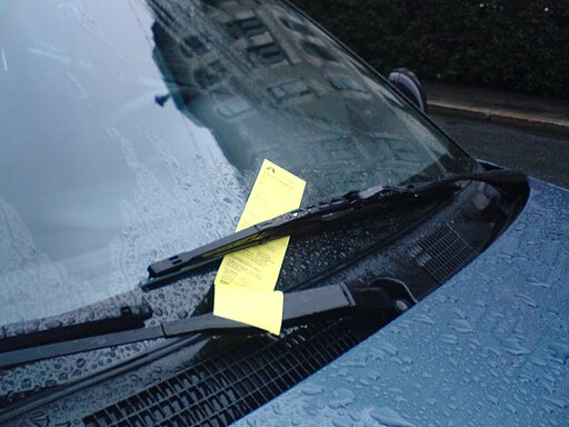 picture of a car with a parking ticket