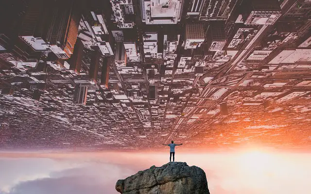 picture of a man under sky scrapers 