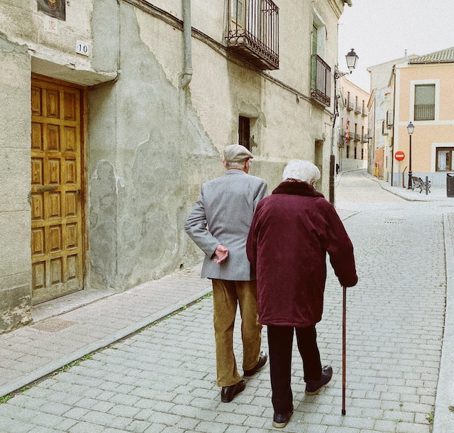 picture of an old couple walking 