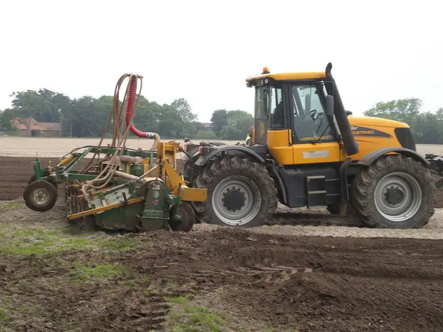 picture of a tractor with a cultivator 