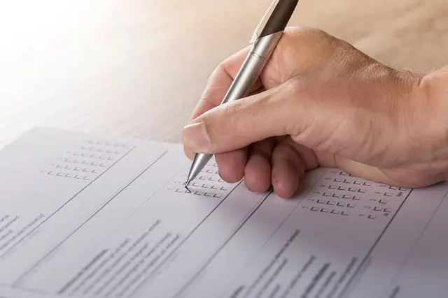 picture of a person filling in a survey 